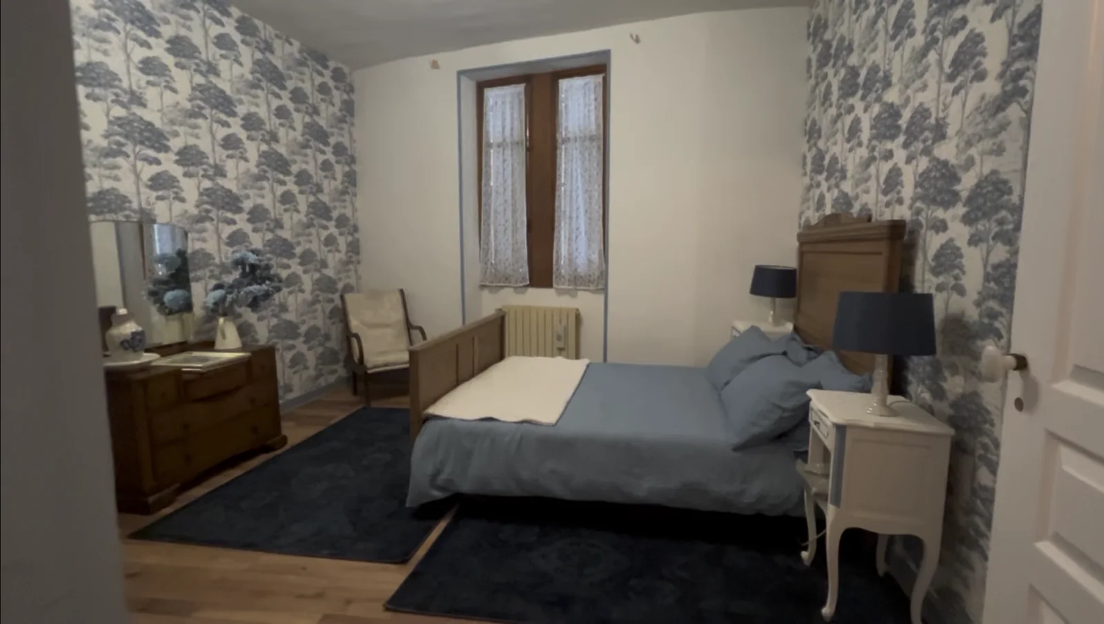 Spacious blue bedroom at La Belle Maison Rose