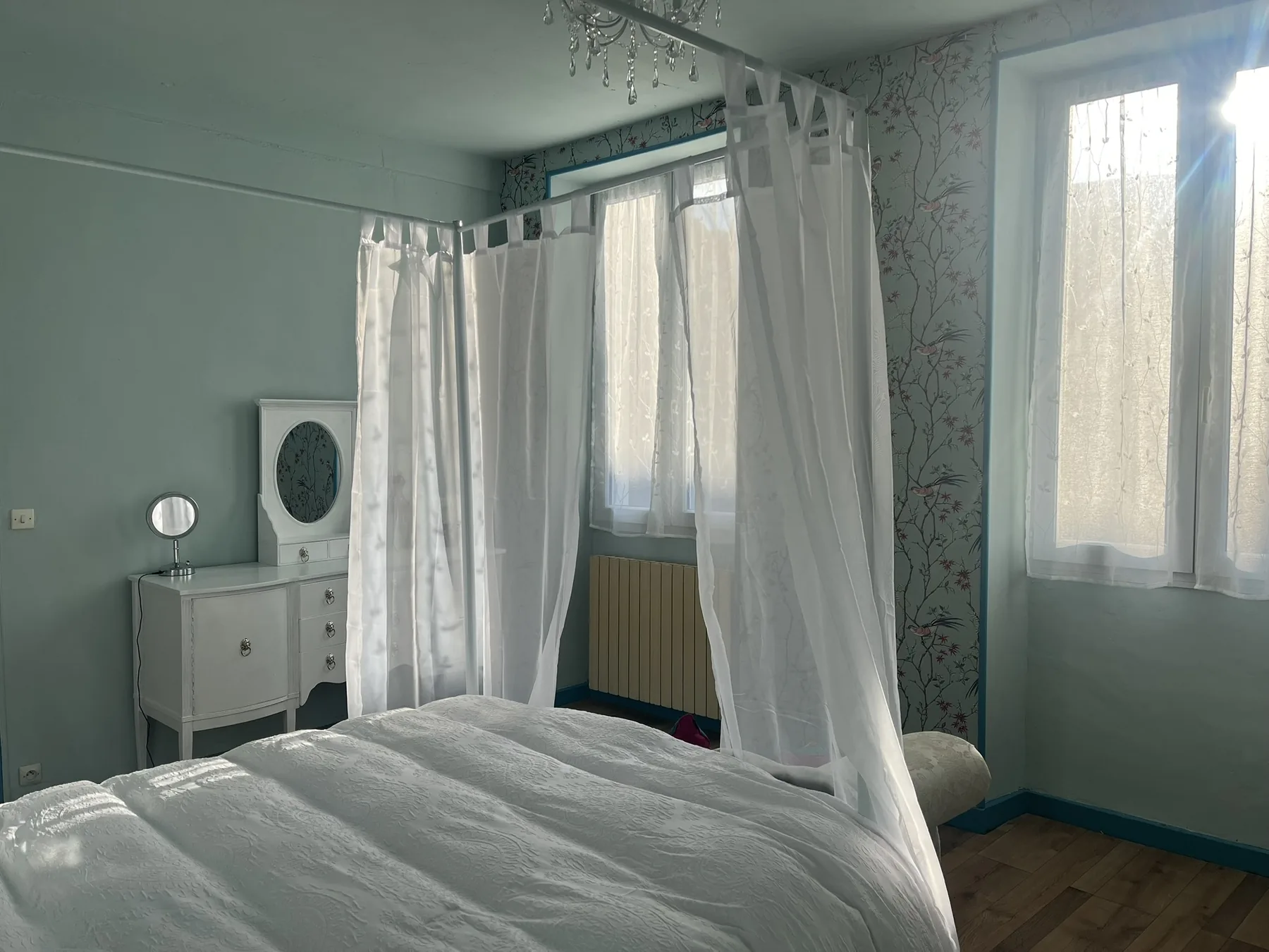 Bright blue bedroom at La Belle Maison Rose